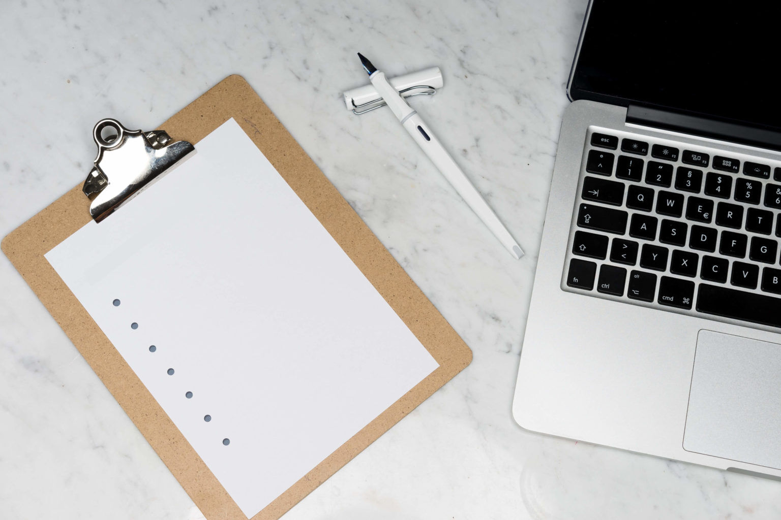 note pad and laptop